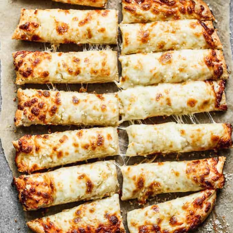 Cheesy Bread Sticks with Marinara Sauce.