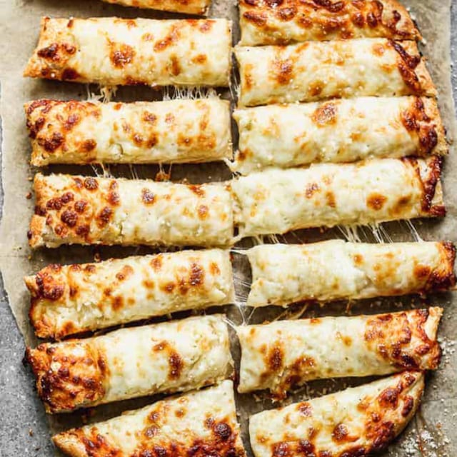 Cheesy Bread Sticks with Marinara Sauce.